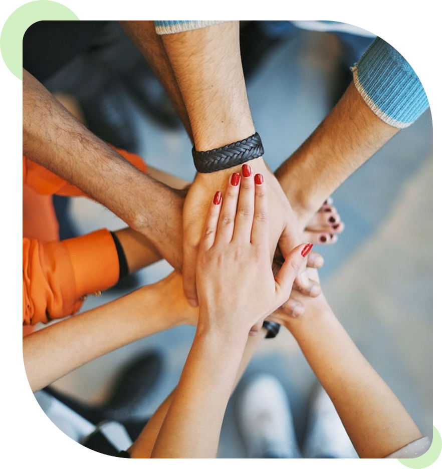 Hands joined in a teamwork gesture.