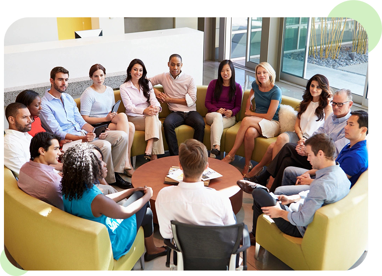 Group meeting in a bright conference room.