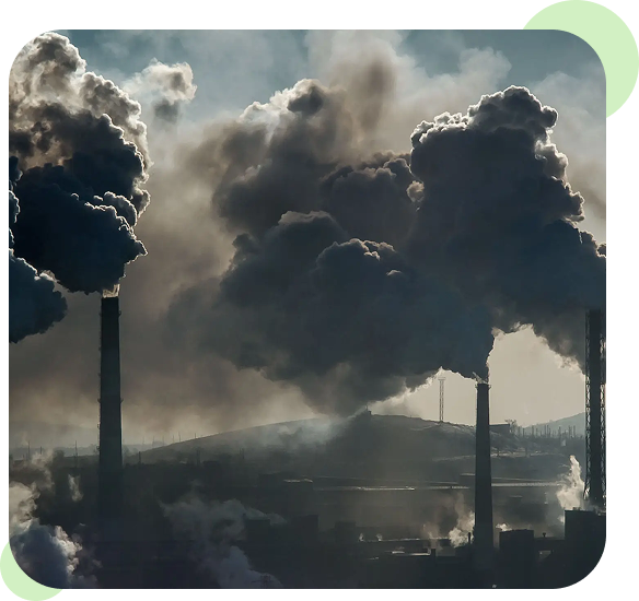 Factories emitting thick black smoke into the sky.