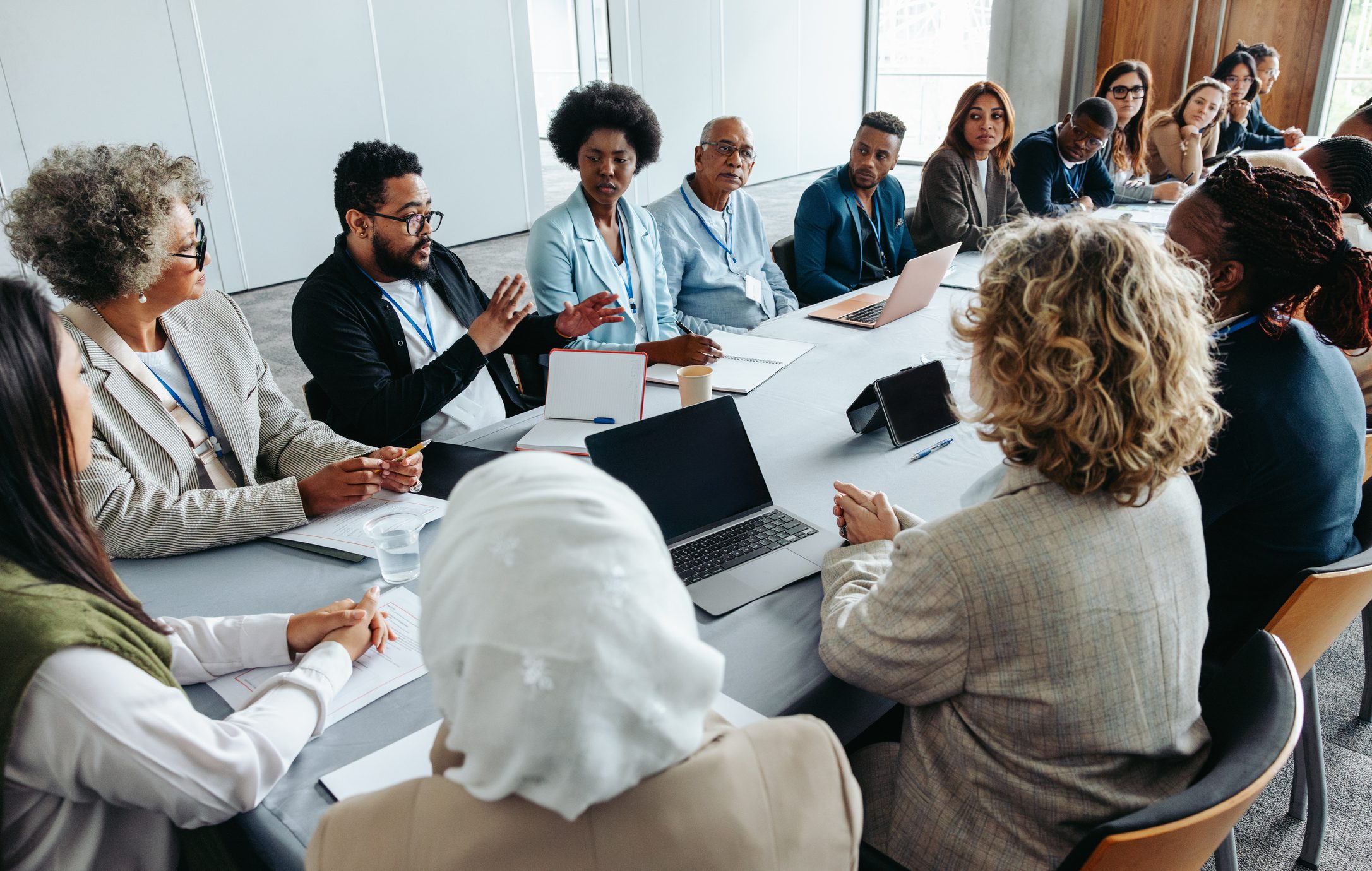 A diverse group engaged in a collaborative business meeting.