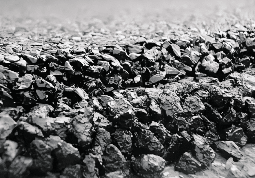 Close-up of black coal pieces on ground.
