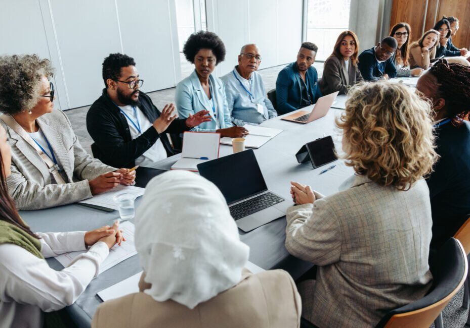 A diverse group engaged in a collaborative business meeting.